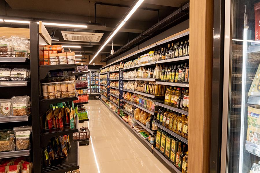 Supermarket aisle with stocked shelves