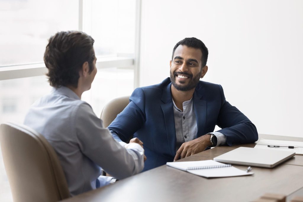 Two business people shaking hands